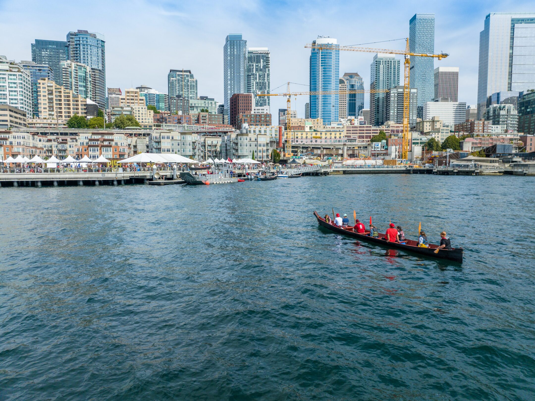 A Coast Salish canoe approaches Pier 62 from the west.