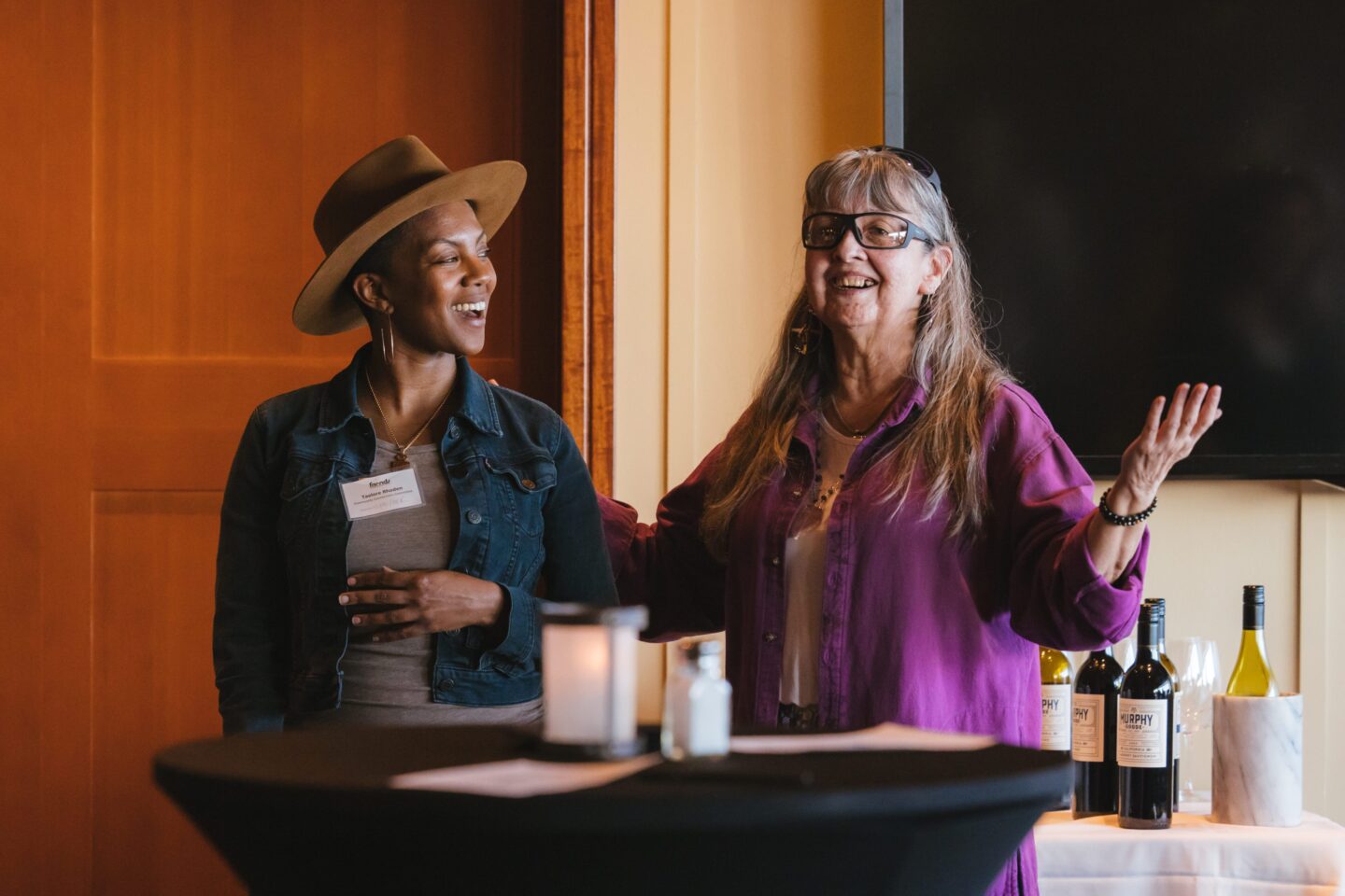 Elany Kayce (right) greets and welcomes new 2023 Community Partnership Committee members including Taelore Rhoden (right) at a luncheon earlier this year. Photo by Sunny Martini.