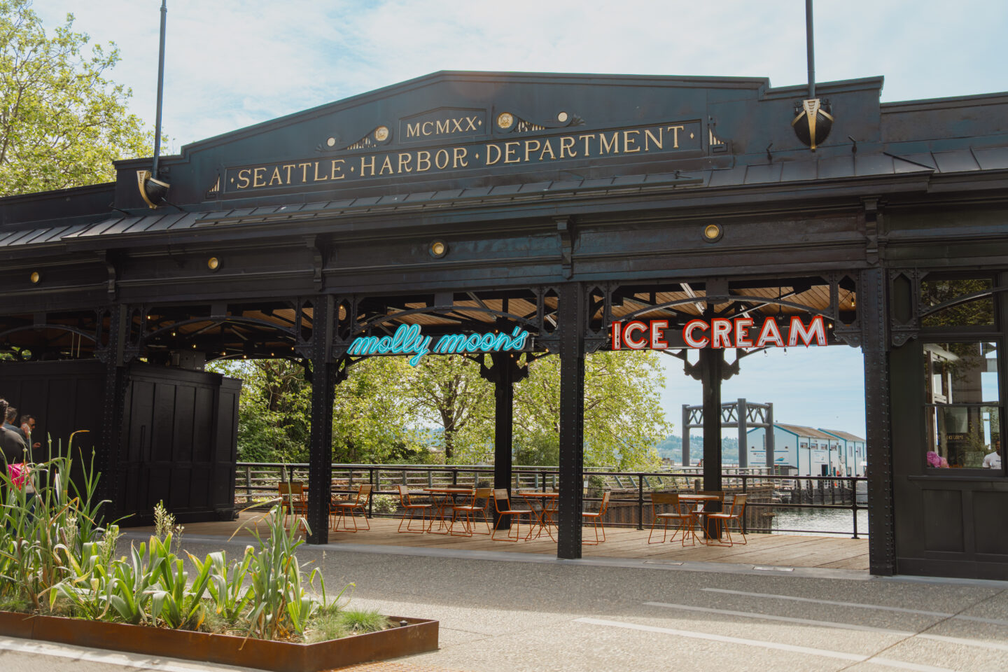 Renovated black Washington Street Boat Landing entrance with new Molly Moon's sign.
