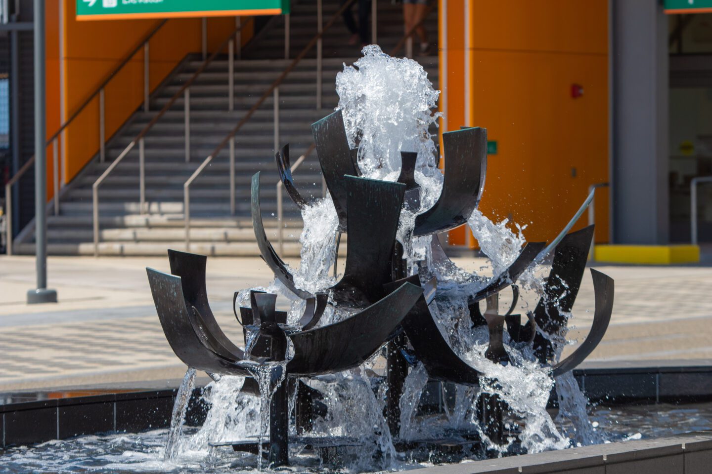 Close-up of the Tsutakawa Fountain with water cascading from sculptural bronze forms at Waterfront Park.