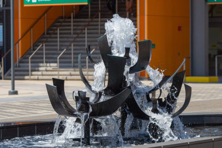Close-up of the Tsutakawa Fountain with water cascading from sculptural bronze forms at Waterfront Park.