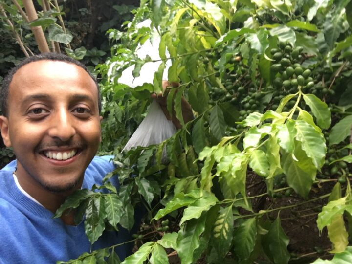 Photo of Efrem with a coffee tree outside of his Great Aunt’s house in Debre Zeyt, Ethiopia (2017).
