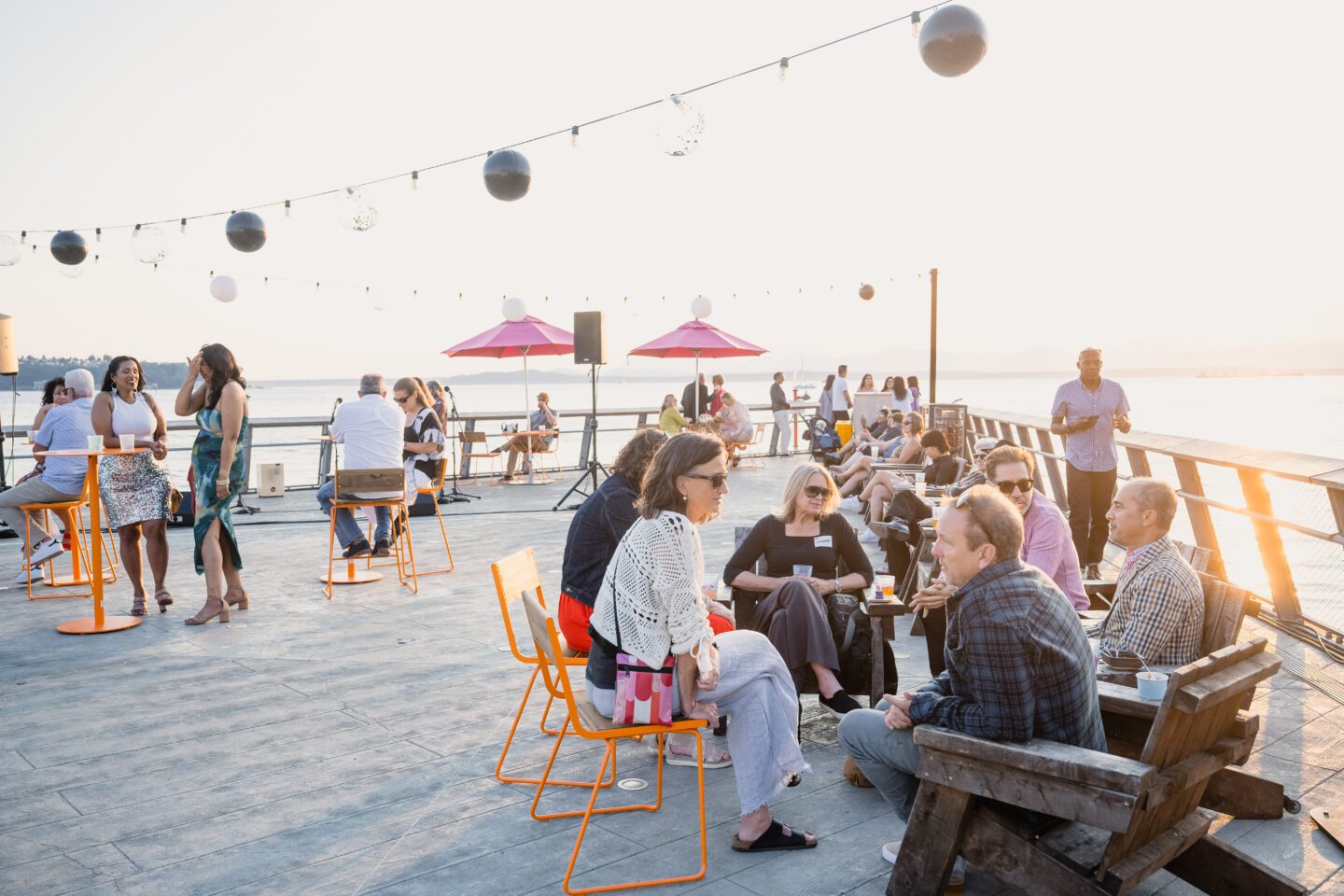People sitting on furniture at Pier 62 during 2024 Pier Party.