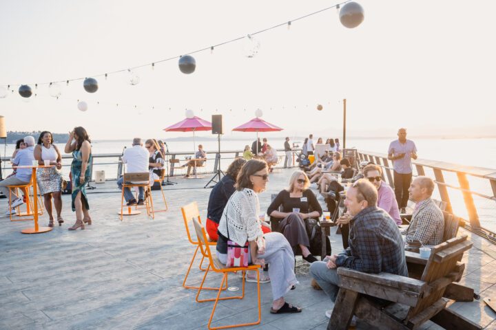 People sitting on furniture at Pier 62 during 2024 Pier Party.