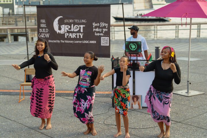 Four dancers perform barefoot on Salish Steps.